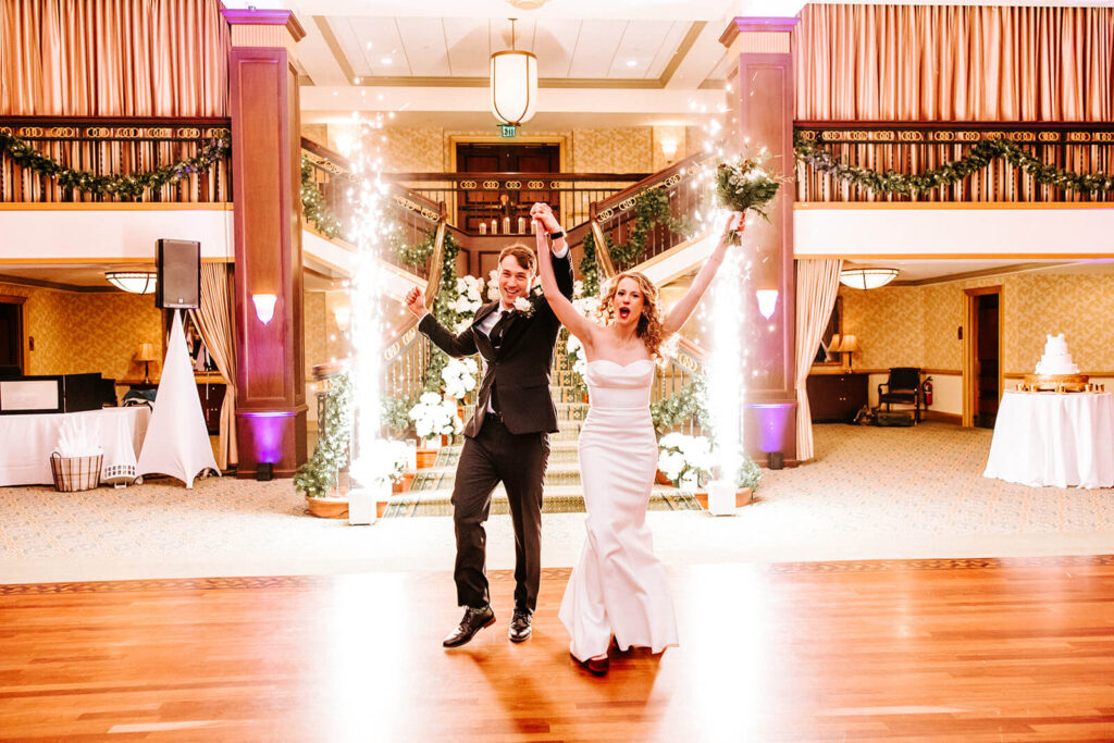 Newlyweds celebrating their reception entrance at Collingswood Grand Ballroom