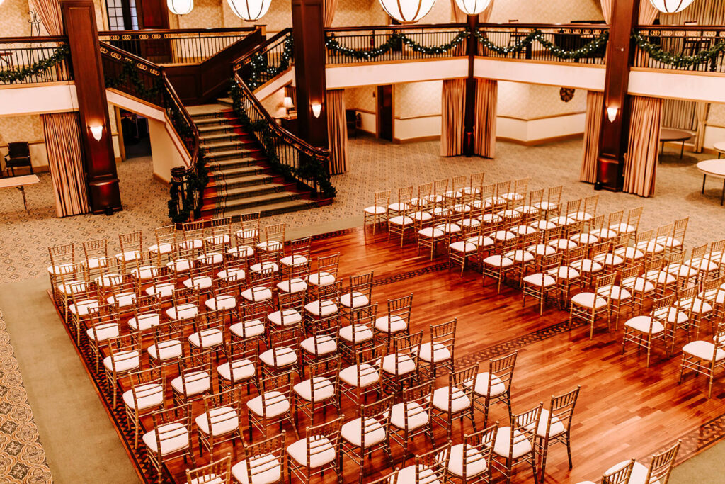Wide view of the indoor ceremony space and grand staircase at Collingswood Grand Ballroom