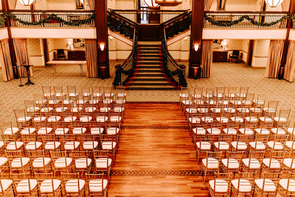 Indoor ceremony setup featuring the grand staircase at Collingswood Grand Ballroom