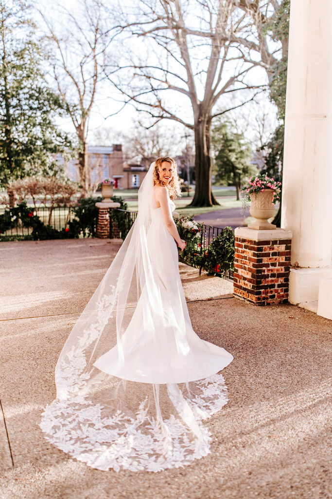 Bride twirling in front of the Collingswood Grand Ballroom entrance