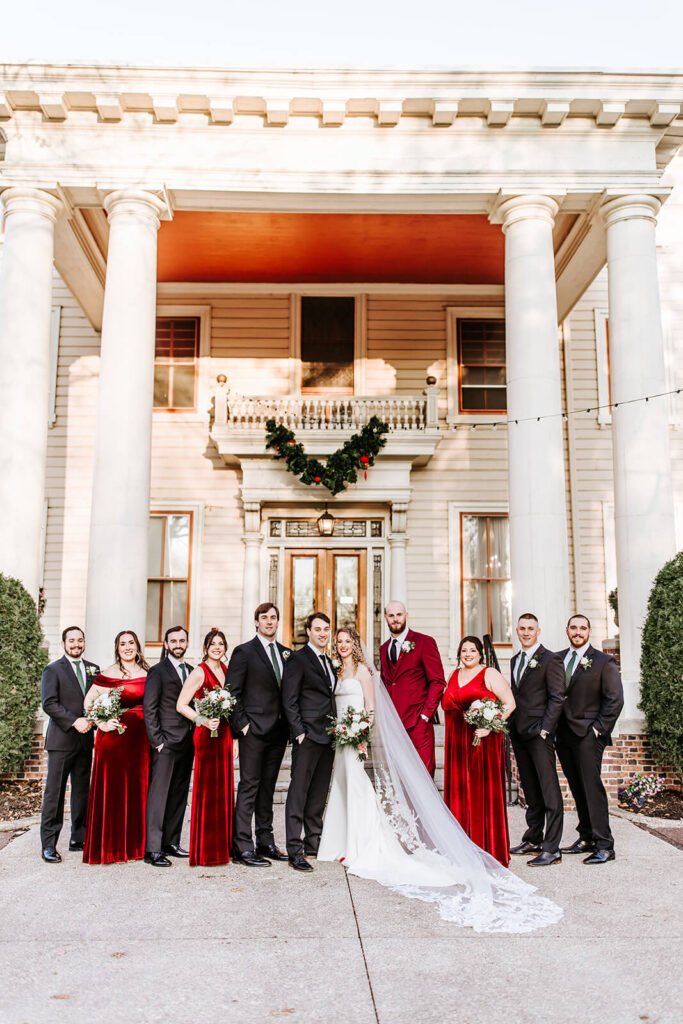 Full wedding party portrait in front of Collingswood Grand Ballroom