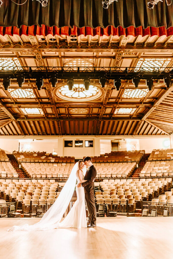 Romantic bride and groom portrait inside the Collingswood Grand Ballroom theater