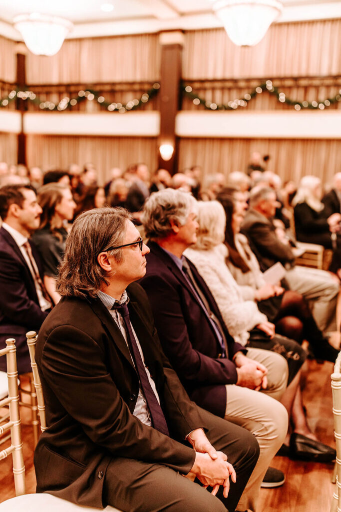 Guests watching the wedding ceremony inside Collingswood Grand Ballroom