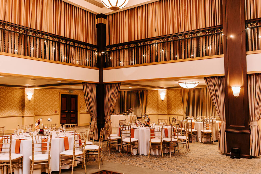 Reception tables beneath the wraparound mezzanine at Collingswood Grand Ballroom