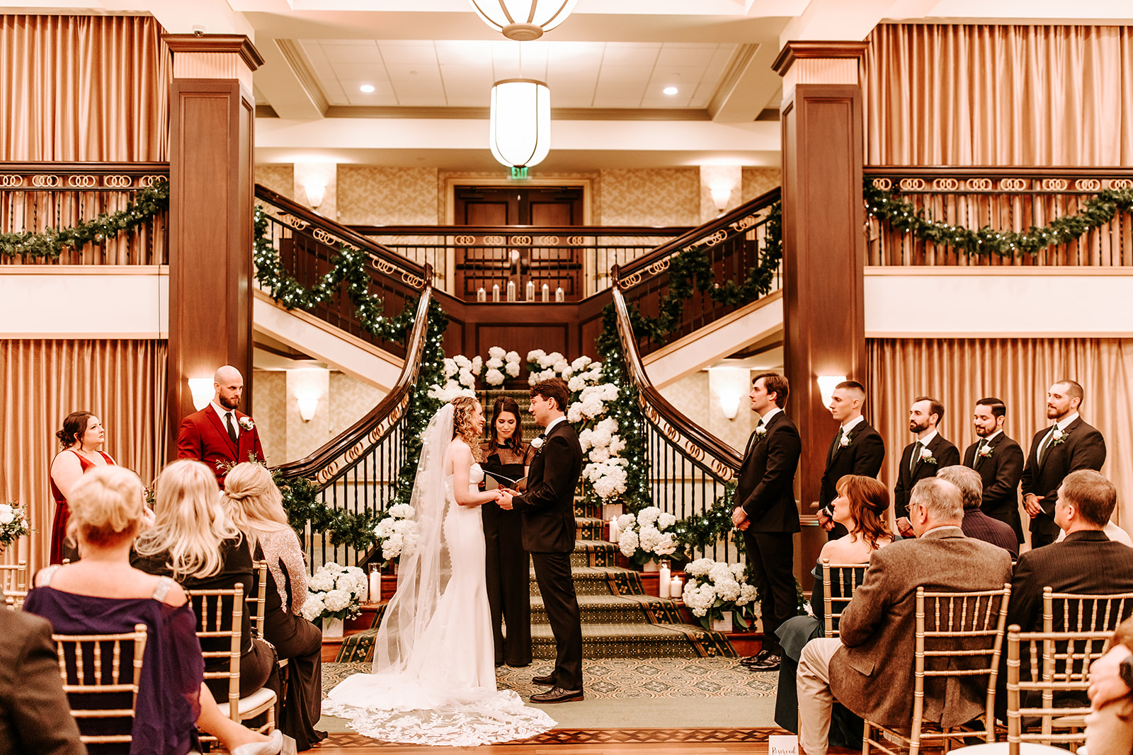 The couple exchanged vows during their elegant indoor ceremony.